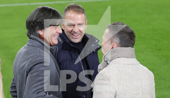 2021-11-11 - Joachim Low, Hansi Flick and Lothar Matthaus during the FIFA World Cup 2022, Qualifiers Group J football match between Germany and Liechtenstein on November 11, 2021 at Volkswagen Arena in Wolfsburg, Germany - FIFA WORLD CUP 2022, QUALIFIERS GROUP J - GERMANY VS LIECHTENSTEIN - FIFA WORLD CUP - SOCCER