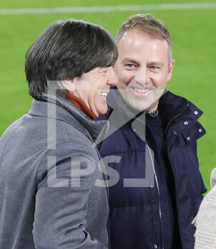 2021-11-11 - Joachim Low, Hansi Flick during the FIFA World Cup 2022, Qualifiers Group J football match between Germany and Liechtenstein on November 11, 2021 at Volkswagen Arena in Wolfsburg, Germany - FIFA WORLD CUP 2022, QUALIFIERS GROUP J - GERMANY VS LIECHTENSTEIN - FIFA WORLD CUP - SOCCER