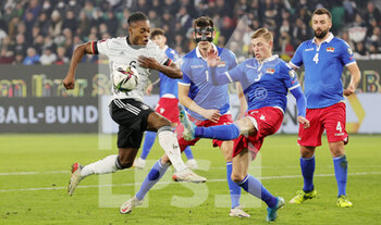 2021-11-11 - Ridle Baku of Germany and Maximilian Goppel of Liechtenstein during the FIFA World Cup 2022, Qualifiers Group J football match between Germany and Liechtenstein on November 11, 2021 at Volkswagen Arena in Wolfsburg, Germany - FIFA WORLD CUP 2022, QUALIFIERS GROUP J - GERMANY VS LIECHTENSTEIN - FIFA WORLD CUP - SOCCER
