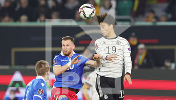 2021-11-11 - Leroy Sane of Germany and Sandro Wolfinger of Liechtenstein during the FIFA World Cup 2022, Qualifiers Group J football match between Germany and Liechtenstein on November 11, 2021 at Volkswagen Arena in Wolfsburg, Germany - FIFA WORLD CUP 2022, QUALIFIERS GROUP J - GERMANY VS LIECHTENSTEIN - FIFA WORLD CUP - SOCCER