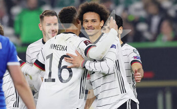2021-11-11 - Leroy Sane of Germany celebrates with Lukas Nmecha during the FIFA World Cup 2022, Qualifiers Group J football match between Germany and Liechtenstein on November 11, 2021 at Volkswagen Arena in Wolfsburg, Germany - FIFA WORLD CUP 2022, QUALIFIERS GROUP J - GERMANY VS LIECHTENSTEIN - FIFA WORLD CUP - SOCCER