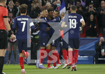 2021-11-13 - Kylian Mbappe of France celebrates his goal with Kingsley Coman, Jules Kounde during the FIFA World Cup 2022, Qualifiers Group D football match between France and Kazakhstan on November 13, 2021 at Parc des Princes, Paris, France - FIFA WORLD CUP 2022, QUALIFIERS GROUP D - FRANCE VS KAZAKHSTAN - FIFA WORLD CUP - SOCCER