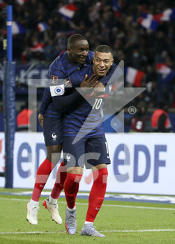 2021-11-13 - Kylian Mbappe of France celebrates his fourth goal with Moussa Diaby during the FIFA World Cup 2022, Qualifiers Group D football match between France and Kazakhstan on November 13, 2021 at Parc des Princes, Paris, France - FIFA WORLD CUP 2022, QUALIFIERS GROUP D - FRANCE VS KAZAKHSTAN - FIFA WORLD CUP - SOCCER