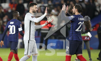 2021-11-13 - Goalkeeper of France Hugo Lloris, Theo Hernandez celebrate the victory and the qualification for the World Cup in Qatar following the FIFA World Cup 2022, Qualifiers Group D football match between France and Kazakhstan on November 13, 2021 at Parc des Princes, Paris, France - FIFA WORLD CUP 2022, QUALIFIERS GROUP D - FRANCE VS KAZAKHSTAN - FIFA WORLD CUP - SOCCER