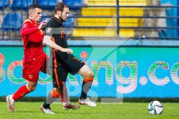2021-11-13 - Vladimir Jovovic of Montenegro battles for the ball with Daley Blind of the Netherlands during the FIFA World Cup 2022, Qualifiers Group G football match between Montenegro and Netherlands on November 13, 2021 at Gradski Stadion Podgorica in Podgorica, Montenegro - FIFA WORLD CUP 2022, QUALIFIERS GROUP G - MONTENEGRO VS NETHERLANDS - FIFA WORLD CUP - SOCCER