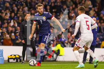 2021-11-15 - Stephen O'Donnell of Scotland and Joakim Maehle of Denmark during the FIFA World Cup 2022, Qualifiers Group F football match between Scotland and Denmark on November 15, 2021 at Hampden Park stadium in Glasgow, Scotland - FIFA WORLD CUP 2022, QUALIFIERS GROUP F - SCOTLAND VS DENMARK - FIFA WORLD CUP - SOCCER