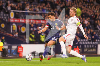 2021-11-15 - Che Adams of Scotland and Simon Kjaer of Denmark during the FIFA World Cup 2022, Qualifiers Group F football match between Scotland and Denmark on November 15, 2021 at Hampden Park stadium in Glasgow, Scotland - FIFA WORLD CUP 2022, QUALIFIERS GROUP F - SCOTLAND VS DENMARK - FIFA WORLD CUP - SOCCER