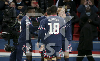 2021-12-07 - Kylian Mbappe of PSG celebrates his goal with Nuno Mendes and teammates during the UEFA Champions League, Group A football match between Paris Saint-Germain (PSG) and Club Brugge on December 7, 2021 at Parc des Princes stadium in Paris, France - PARIS SAINT-GERMAIN VS CLUB BRUGGE - UEFA CHAMPIONS LEAGUE - SOCCER