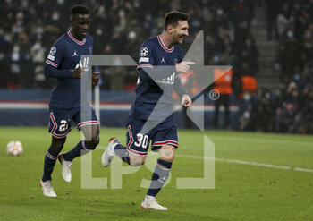 2021-12-07 - Lionel Messi of PSG celebrates his first goal with Idrissa Gueye Gana (left) during the UEFA Champions League, Group A football match between Paris Saint-Germain (PSG) and Club Brugge on December 7, 2021 at Parc des Princes stadium in Paris, France - PARIS SAINT-GERMAIN VS CLUB BRUGGE - UEFA CHAMPIONS LEAGUE - SOCCER