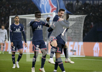 2021-12-07 - Lionel Messi of PSG celebrates his first goal with Kylian Mbappe, left Idrissa Gueye Gana, Achraf Hakimi during the UEFA Champions League, Group A football match between Paris Saint-Germain (PSG) and Club Brugge on December 7, 2021 at Parc des Princes stadium in Paris, France - PARIS SAINT-GERMAIN VS CLUB BRUGGE - UEFA CHAMPIONS LEAGUE - SOCCER