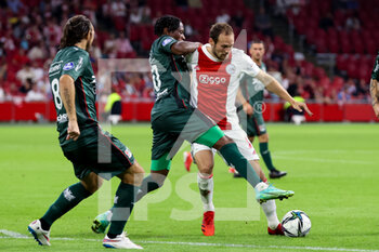 2021-08-14 - Jonathan Okita of NEC and Daley Blind of Ajax during the Netherlands championship Eredivisie football match between Ajax and NEC on August 14, 2021 at the Johan Cruijff ArenA in Amsterdam, Netherlands - Photo Herman Dingler / Orange Pictures / DPPI - AJAX VS NEC - NETHERLANDS EREDIVISIE - SOCCER