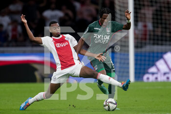 2021-08-14 - Ryan Gravenberch of Ajax and Jonathan Okita of NEC during the Netherlands championship Eredivisie football match between Ajax and NEC on August 14, 2021 at the Johan Cruijff ArenA in Amsterdam, Netherlands - Photo Broer van den Boom / Orange Pictures / DPPI - AJAX VS NEC - NETHERLANDS EREDIVISIE - SOCCER