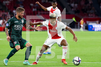 2021-08-14 - Lasse Schone of NEC and David Neres of Ajax during the Netherlands championship Eredivisie football match between Ajax and NEC on August 14, 2021 at the Johan Cruijff ArenA in Amsterdam, Netherlands - Photo Herman Dingler / Orange Pictures / DPPI - AJAX VS NEC - NETHERLANDS EREDIVISIE - SOCCER