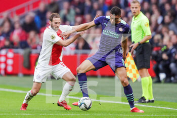 2021-10-24 - Daley Blind of Ajax battles for the ball with Carlos Vinicius of PSV during the Netherlands championship Eredivisie football match between Ajax and PSV on October 24, 2021 at Johan Cruijff Arena in Amsterdam, Netherlands - AJAX VS PSV - NETHERLANDS EREDIVISIE - SOCCER