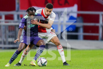 2021-10-24 - Bruma of PSV battles for the ball with Noussair Mazraoui of Ajax during the Netherlands championship Eredivisie football match between Ajax and PSV on October 24, 2021 at Johan Cruijff Arena in Amsterdam, Netherlands - AJAX VS PSV - NETHERLANDS EREDIVISIE - SOCCER