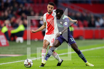 2021-10-24 - Noussair Mazraoui of Ajax battles for the ball with Bruma of PSV during the Netherlands championship Eredivisie football match between Ajax and PSV on October 24, 2021 at Johan Cruijff Arena in Amsterdam, Netherlands - AJAX VS PSV - NETHERLANDS EREDIVISIE - SOCCER