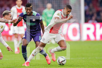 2021-10-24 - Sebastien Haller of Ajax battles for the ball with Ibrahim Sangare of PSV during the Netherlands championship Eredivisie football match between Ajax and PSV on October 24, 2021 at Johan Cruijff Arena in Amsterdam, Netherlands - AJAX VS PSV - NETHERLANDS EREDIVISIE - SOCCER