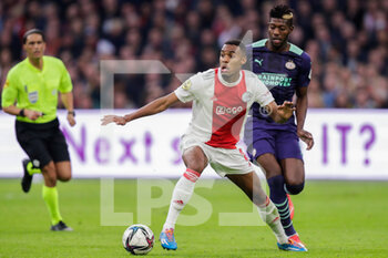 2021-10-24 - Ryan Gravenberch of Ajax battles for the ball with Ibrahim Sangare of PSV during the Netherlands championship Eredivisie football match between Ajax and PSV on October 24, 2021 at Johan Cruijff Arena in Amsterdam, Netherlands - AJAX VS PSV - NETHERLANDS EREDIVISIE - SOCCER