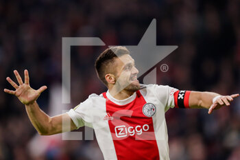 2021-10-24 - Dusan Tadic of Ajax celebrates after scoring his sides fifth goal during the Netherlands championship Eredivisie football match between Ajax and PSV on October 24, 2021 at Johan Cruijff Arena in Amsterdam, Netherlands - AJAX VS PSV - NETHERLANDS EREDIVISIE - SOCCER