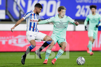 2021-11-28 - Rami Kaib of SC Heerenveen and Ritsu Doan of PSV during the Netherlands championship Eredivisie football match between SC Heerenveen and PSV on November 28, 2021 at the Abe Lenstra Stadion in Heerenveen, Netherlands - SC HEERENVEEN VS PSV - NETHERLANDS EREDIVISIE - SOCCER