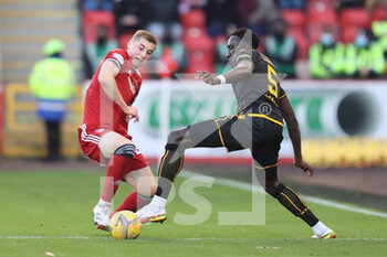 2021-11-06 - Aberdeen's Dean Campbell (24) and Motherwell's Bevis Mugabi (5) during the Scottish championship Premiership football match between Aberdeen and Motherwell on November 6, 2021 at Pittodrie Stadium in Aberdeen, Scotland - ABERDEEN VS MOTHERWELL - SCOTTISH PREMIERSHIP - SOCCER