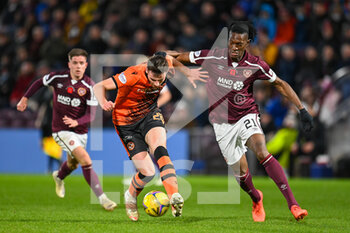 2021-11-06 - Kerr Smith of Dundee Utd FC holds off Armand Gnanduillet of Heart of Midlothian during the Scottish championship, Premiership football match between Heart of Midlothian and Dundee United on November 6, 2021 at Tynecastle Park in Edinburgh, Scotland - HEART OF MIDLOTHIAN VS DUNDEE UNITED - SCOTTISH PREMIERSHIP - SOCCER