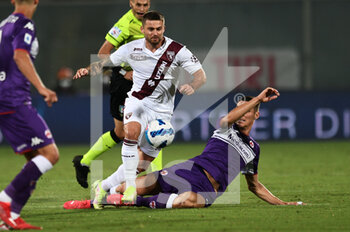 2021-08-28 - Karol Linetty (Torino FC) in action against Nikola Milemkovic (ACF Fiorentina - ACF FIORENTINA VS TORINO FC - ITALIAN SERIE A - SOCCER