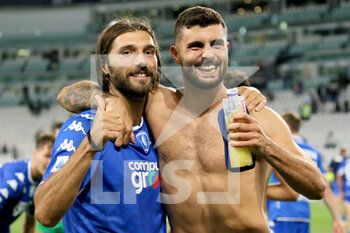 2021-08-28 - Leonardo Mancuso and Patrick Cutrone (Empoli FC) celebrates the victory in the match - JUVENTUS FC VS EMPOLI FC - ITALIAN SERIE A - SOCCER