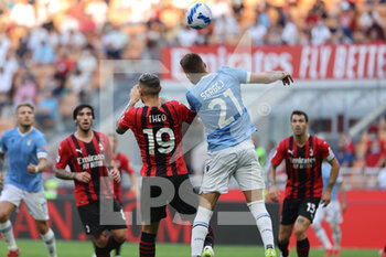 2021-09-12 - Theo Hernandez of AC Milan fights for the ball against Sergej Milinkovic-Savic of SS Lazio during the Serie A 2021/22 football match between AC Milan and SS Lazio at Giuseppe Meazza Stadium, Milan, Italy on September 12, 2021 - AC MILAN VS SS LAZIO - ITALIAN SERIE A - SOCCER