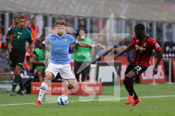 2021-09-12 - Ciro Immobile of SS Lazio in action with Fikayo Tomori of AC Milan during the Serie A 2021/22 football match between AC Milan and SS Lazio at Giuseppe Meazza Stadium, Milan, Italy on September 12, 2021 - AC MILAN VS SS LAZIO - ITALIAN SERIE A - SOCCER