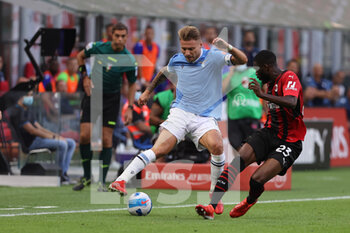 2021-09-12 - Ciro Immobile of SS Lazio fights for the ball against \m23during the Serie A 2021/22 football match between AC Milan and SS Lazio at Giuseppe Meazza Stadium, Milan, Italy on September 12, 2021 - AC MILAN VS SS LAZIO - ITALIAN SERIE A - SOCCER
