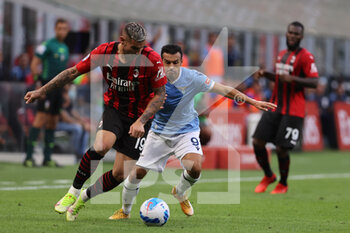 2021-09-12 - Theo Hernandez of AC Milan fights for the ball against Pedro of SS Lazio during the Serie A 2021/22 football match between AC Milan and SS Lazio at Giuseppe Meazza Stadium, Milan, Italy on September 12, 2021 - AC MILAN VS SS LAZIO - ITALIAN SERIE A - SOCCER