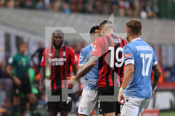 2021-09-12 - Theo Hernandez of AC Milan and Pedro of SS Lazio during the Serie A 2021/22 football match between AC Milan and SS Lazio at Giuseppe Meazza Stadium, Milan, Italy on September 12, 2021 - AC MILAN VS SS LAZIO - ITALIAN SERIE A - SOCCER