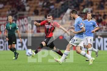2021-09-12 - Ante Rebic of AC Milan fights for the ball against Francesco Acerbi of SS Lazio during the Serie A 2021/22 football match between AC Milan and SS Lazio at Giuseppe Meazza Stadium, Milan, Italy on September 12, 2021 - AC MILAN VS SS LAZIO - ITALIAN SERIE A - SOCCER
