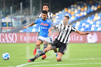 2021-09-11 - Napoli's forward Lorenzo Insigne is tackled by Juventus' defender Mattia De Sciglio  - SSC NAPOLI VS JUVENTUS FC - ITALIAN SERIE A - SOCCER
