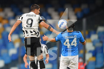 2021-09-11 - Juventus' forward Alvaro Morata jump for the ball with Napoli's defender Konstas Manolas  - SSC NAPOLI VS JUVENTUS FC - ITALIAN SERIE A - SOCCER