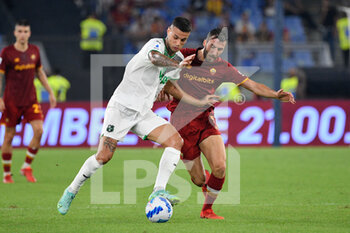 2021-09-12 - Gianluca Scamacca of US Sassuolo Calcio and Lorenzo Pellegrini of AS Roma in action during the  Italian Football Championship League A 2021/2022 match between AS Roma vs US Sassuolo at the Olimpic Stadium in Rome. - AS ROMA VS US SASSUOLO - ITALIAN SERIE A - SOCCER