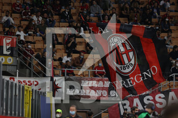 2021-09-22 - A fan waves a giant flag during the Serie A 2021/22 football match between AC Milan and Venezia FC at Giuseppe Meazza Stadium, Milan, Italy on September 22, 2021 - AC MILAN VS VENEZIA FC - ITALIAN SERIE A - SOCCER