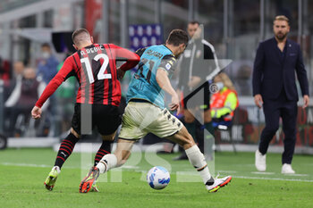 2021-09-22 - Ante Rebic of AC Milan fights for the ball against Mattia Calandra of Venezia FC during the Serie A 2021/22 football match between AC Milan and Venezia FC at Giuseppe Meazza Stadium, Milan, Italy on September 22, 2021 - AC MILAN VS VENEZIA FC - ITALIAN SERIE A - SOCCER