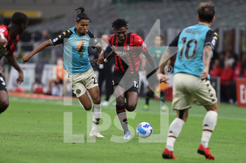 2021-09-22 - Rafael Leao of AC Milan fights for the ball against Tyronne Ebuehi of Venezia FC during the Serie A 2021/22 football match between AC Milan and Venezia FC at Giuseppe Meazza Stadium, Milan, Italy on September 22, 2021 - AC MILAN VS VENEZIA FC - ITALIAN SERIE A - SOCCER