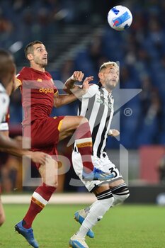 2021-09-23 - ROME, ITALY -  September 23 : Henrikh Mkhitarian (C) of  AS   Roma in action against Roberto Pereyra  (R) of Udinese    during the  Serie A soccer  match between  AS Roma and Udinese   at Stadio Olimpico on September 23,2021 in Rome Italy - AS ROMA VS UDINESE CALCIO - ITALIAN SERIE A - SOCCER