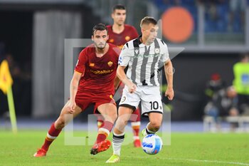 2021-09-23 - ROME, ITALY - September 23  : Gerad Deloufeu  (R) of
Udinese  in action against  Bryan Cristante (L) of AS Roma  during the  Serie A soccer match between  AS Roma and  Udinese  at  Stadio Olimpico on September 23,2021 in Rome Italy - AS ROMA VS UDINESE CALCIO - ITALIAN SERIE A - SOCCER