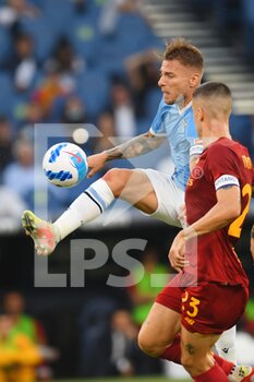 2021-09-26 - ROME, ITALY - September 26 :  Ciro Immobile (L)  of SS Lazio in Action during the  Serie A soccer match between SS Lazio and  AS Roma at Stadio Olimpico on September 26,2021 in Rome, Italy - SS LAZIO VS AS ROMA - ITALIAN SERIE A - SOCCER