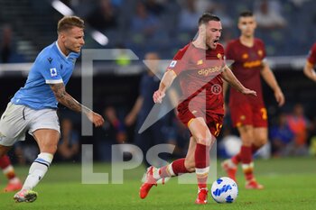 2021-09-26 - ROME, ITALY -  September 26 :  Ciro Immobile (L) of  SS Lazio in action against  Jordan Veretout  (R) of  AS Roma during the  Serie A  soccer match between  SS Lazio and AS Roma Stadio Olimpico on September 26,2021 in Rome, Italy

 - SS LAZIO VS AS ROMA - ITALIAN SERIE A - SOCCER