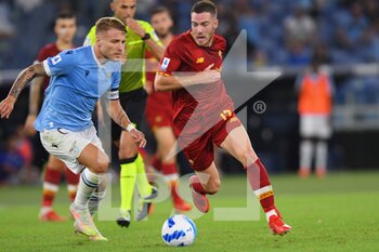 2021-09-26 - ROME, ITALY -  September 26 :  Ciro Immobile (L) of  SS Lazio in action against  Jordan Veretout  (R) of  AS Roma during the  Serie A  soccer match between  SS Lazio and AS Roma Stadio Olimpico on September 26,2021 in Rome, Italy

 - SS LAZIO VS AS ROMA - ITALIAN SERIE A - SOCCER