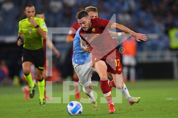 2021-09-26 - 
ROME, ITALY -  September 26 :  Ciro Immobile (L) of  SS Lazio in action against  Jordan Veretout  (R) of  AS Roma during the  Serie A  soccer match between  SS Lazio and AS Roma Stadio Olimpico on September 26,2021 in Rome, Italy

 - SS LAZIO VS AS ROMA - ITALIAN SERIE A - SOCCER