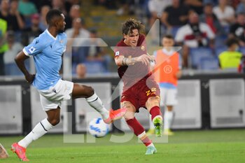 2021-09-26 - ROME, ITALY -  September 26 : Nicolo' Zaniolo  (L) of  AS Roma in action against  Akpa Akpro (R) of SS Lazio during the  Serie A  soccer match between  SS Lazio and AS Roma Stadio Olimpico on September 26,2021  in Rome Italy 

 - SS LAZIO VS AS ROMA - ITALIAN SERIE A - SOCCER