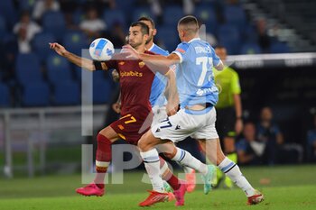 2021-09-26 - ROME, ITALY -  September 26 : Henrikh Mikitarian (L) of  AS Roma in action against  Adam Marusic  (R) of SS Lazio during the  Serie A  soccer match between  SS Lazio and AS Roma Stadio Olimpico on September 26,2021  in Rome Italy 
 - SS LAZIO VS AS ROMA - ITALIAN SERIE A - SOCCER