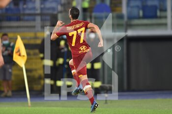 2021-10-03 - ROME, ITALY - October 3 : Henrikh Mkhitaryan of AS Roma  celebrates  after scores a goal during  Italian Serie A soccer match between  AS Roma  and  Empoli FC  at Stadio Olimpico on October 3,2021  in Rome Italy - AS ROMA VS EMPOLI FC - ITALIAN SERIE A - SOCCER