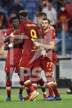 2021-10-03 - ROME, ITALY - October 3 : Players   of AS Roma  celebrates  after Henrikh Mkhitaryanscoring a goal during the Italian Serie A  soccer match between  AS Roma  and Empoli FC  at Stadio Olimpico on October 3,2021 in Rome, Italy - AS ROMA VS EMPOLI FC - ITALIAN SERIE A - SOCCER